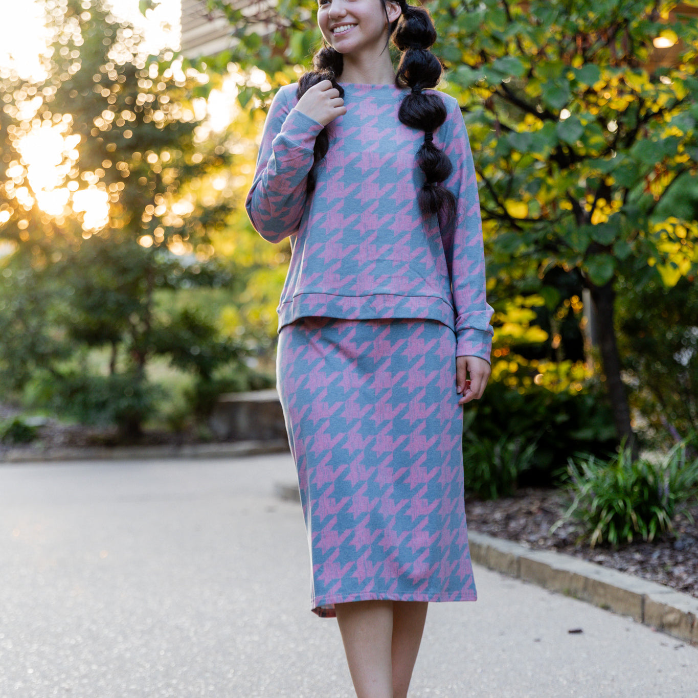 Nuggles® Iris two-piece set featuring soft knit midi skirt and crew-neck sweatshirt top