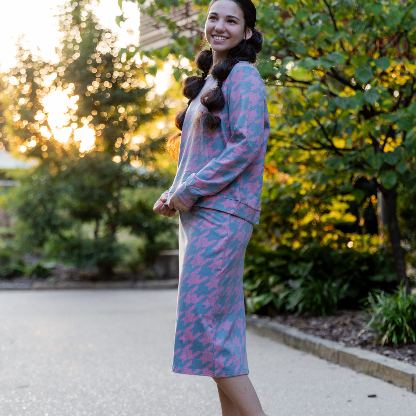 Nuggles® Iris two-piece set featuring soft knit midi skirt and crew-neck sweatshirt top