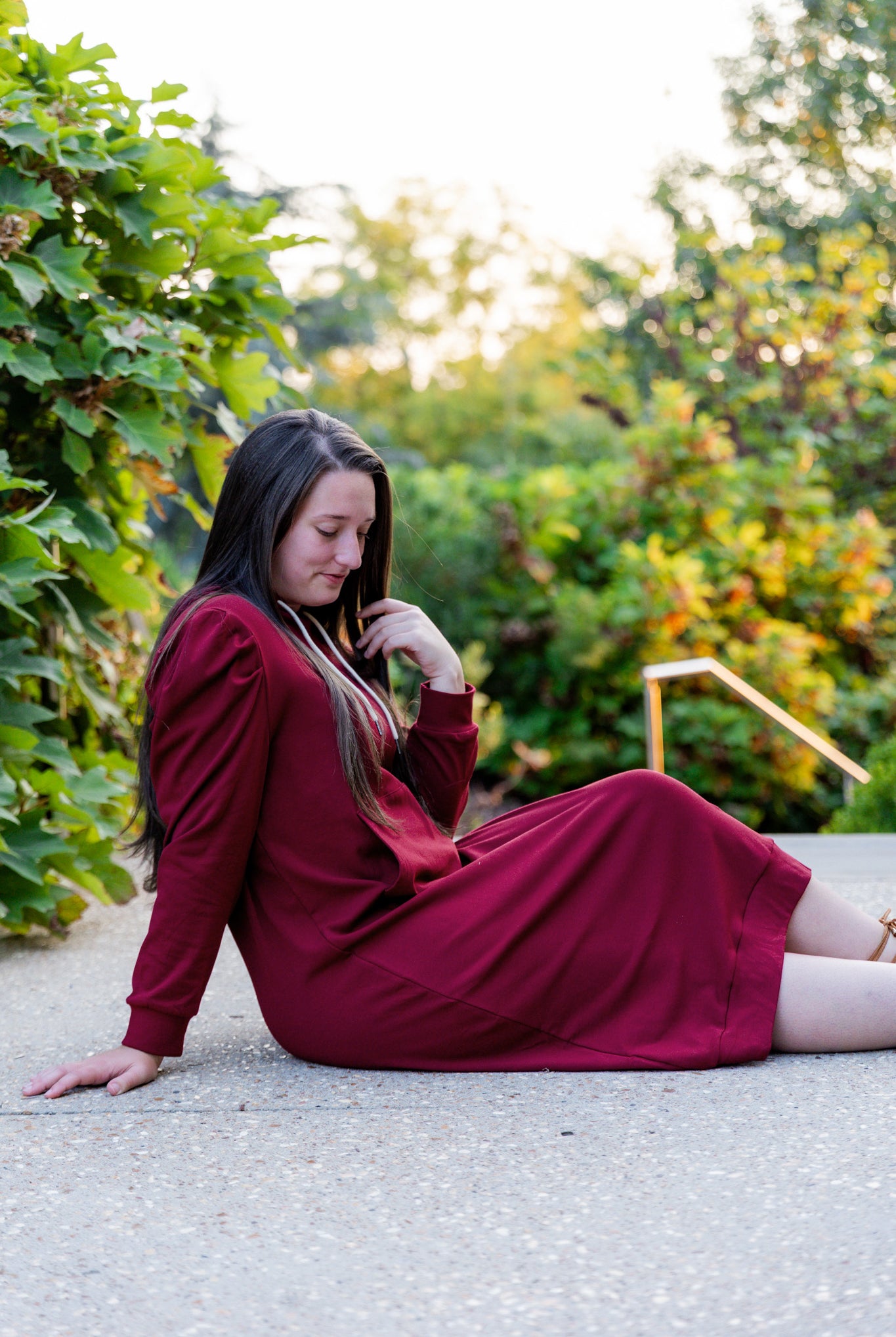Model wearing Nuggles® Zoelle Dress in solid color, modest hoodie dress with puff sleeves.