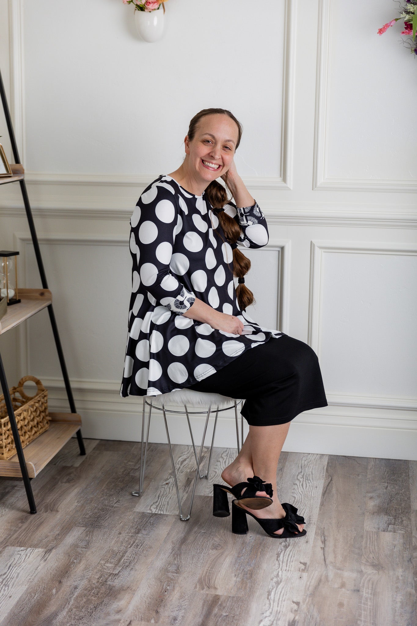 Model wearing the 3/4 Sleeve Victoria Top in floral print, paired with a modest Classic skirt. Modest women’s fashion with 3/4 sleeves and hip-length fit, perfect for church, work, or everyday wear.