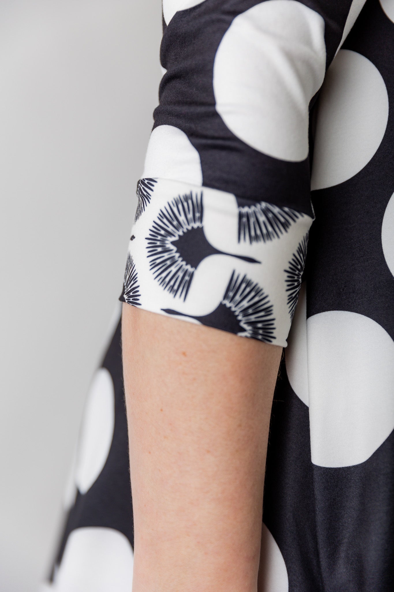 Model wearing the 3/4 Sleeve Victoria Top in floral print, paired with a modest Classic skirt. Modest women’s fashion with 3/4 sleeves and hip-length fit, perfect for church, work, or everyday wear.