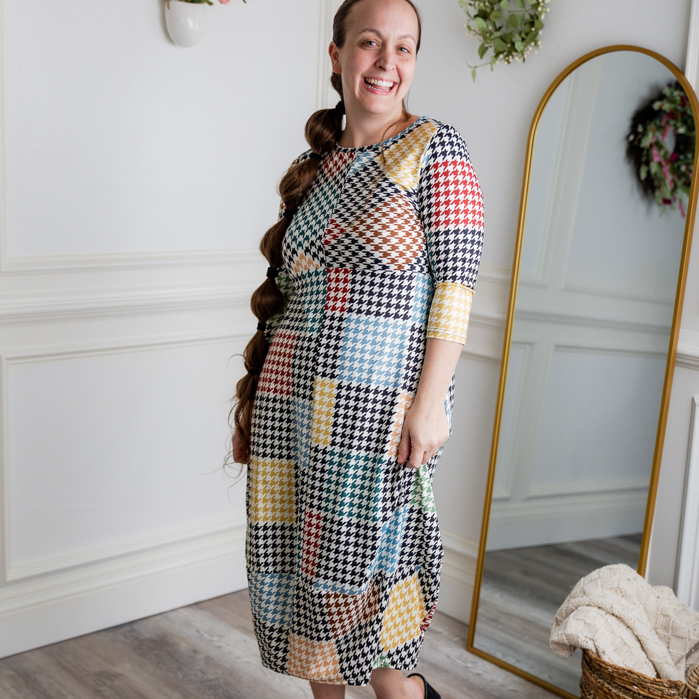 Model wearing the Cindy Bubble Dress with elbow-length sleeves, a modest neckline, and a gathered bubble hem in a midi-length silhouette.