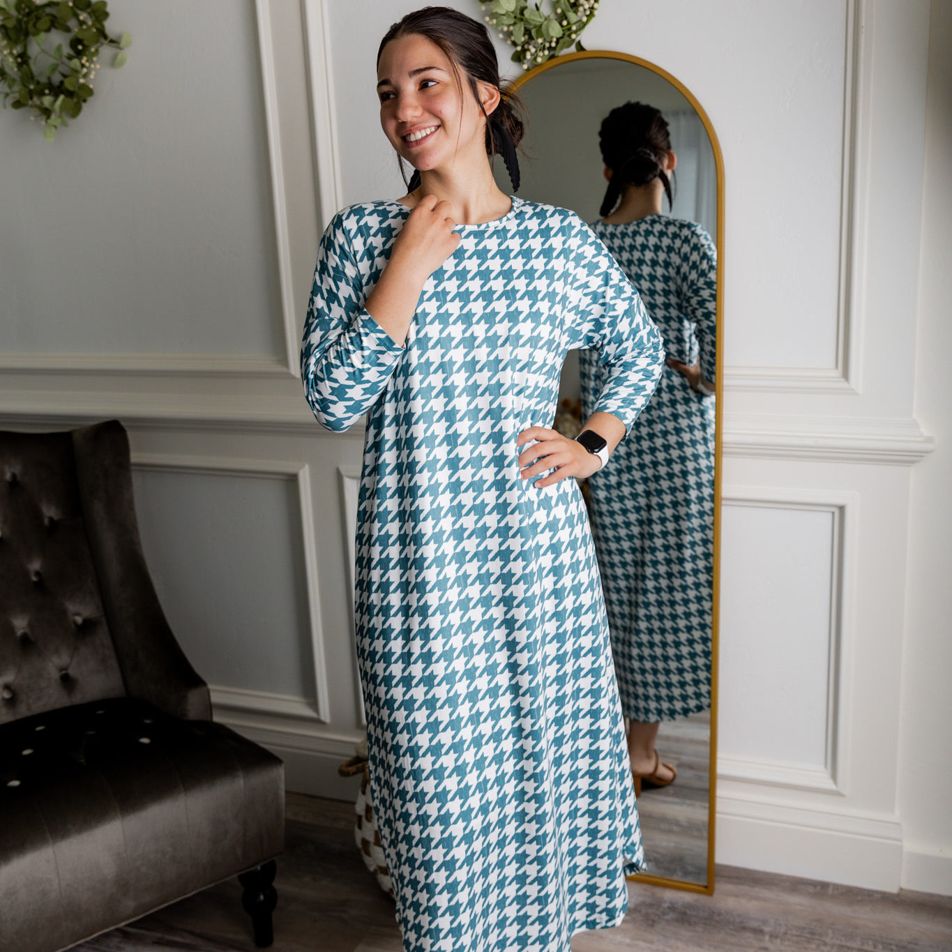 Model wearing Nuggles® Kate Dress in printed fabric, modest midi length with three-quarter sleeves.