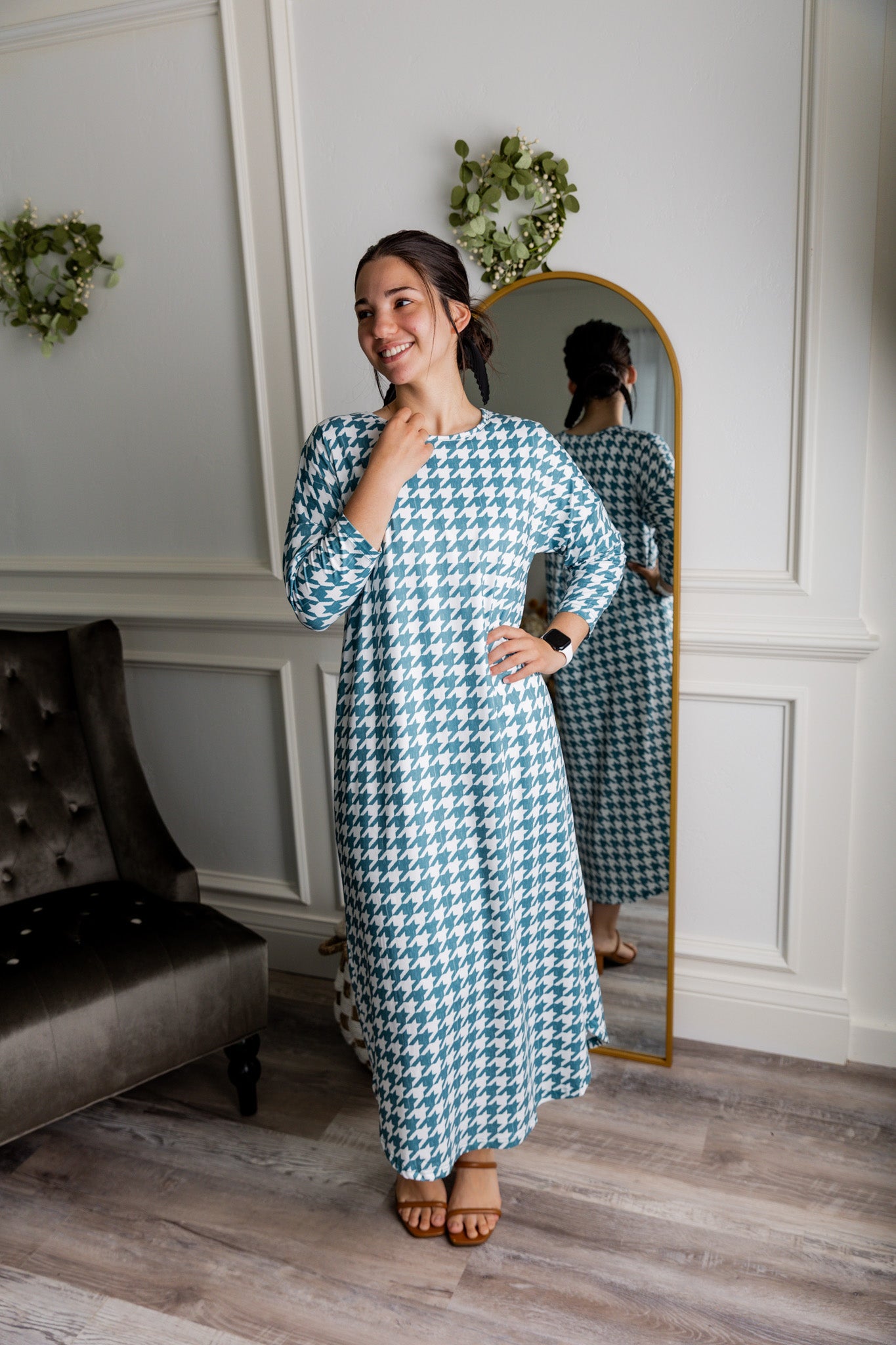Model wearing Nuggles® Kate Dress in printed fabric, modest midi length with three-quarter sleeves.