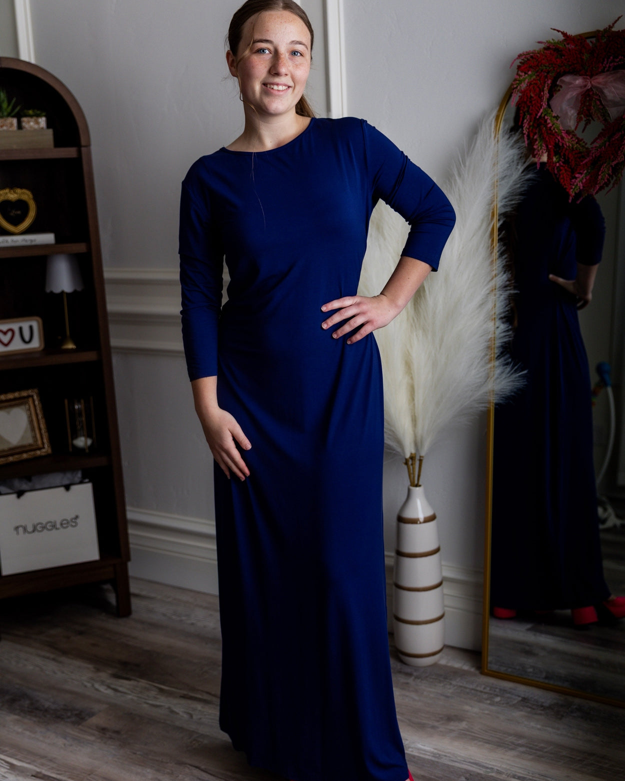 Model wearing Nuggles® Maxi Layering Dress in Dark Blue