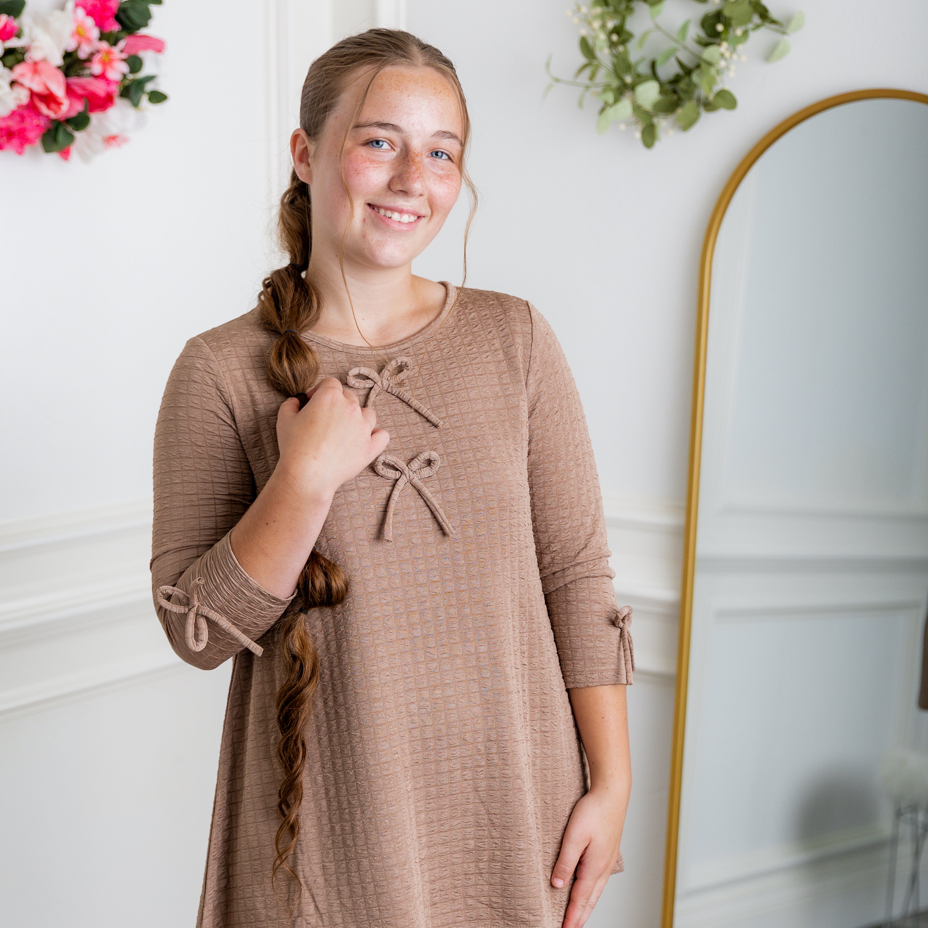 Nuggles® Lexi Top in waffle knit with 3/4 sleeves, bow detail, and modest A-line fit for women