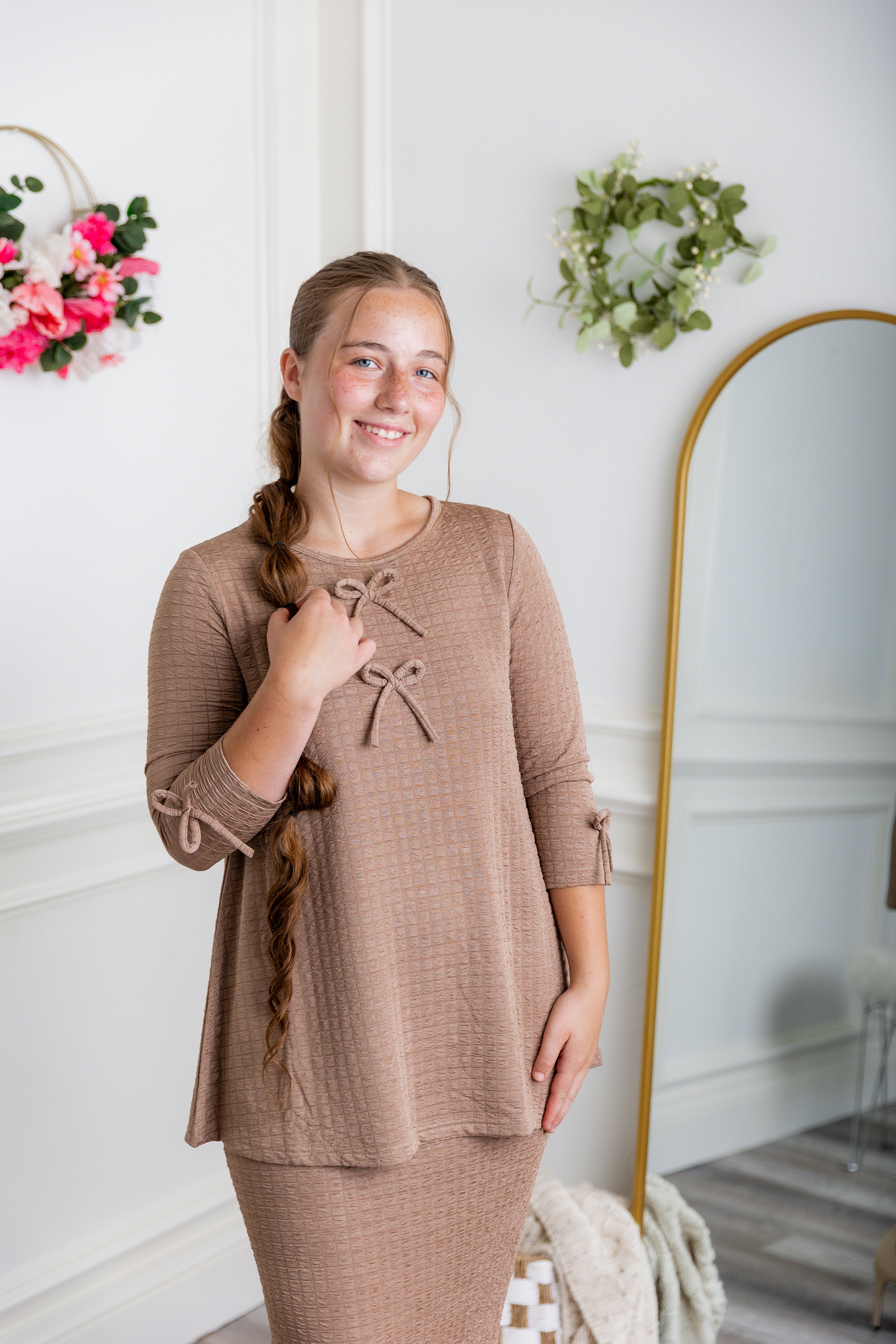 Nuggles® Lexi Top in waffle knit with 3/4 sleeves, bow detail, and modest A-line fit for women