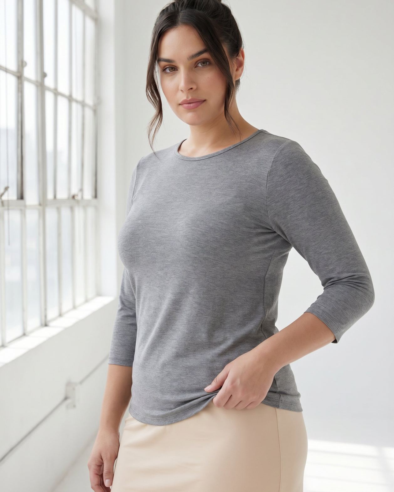 Model wearing Nuggles® 3/4 Essential Tee in Dark Heather