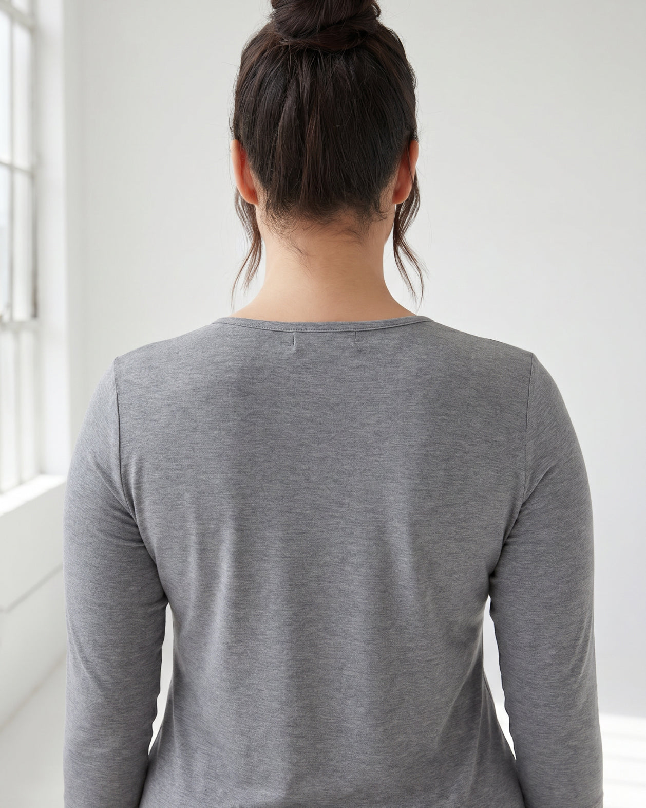 Model wearing Nuggles® 3/4 Essential Tee in Dark Heather