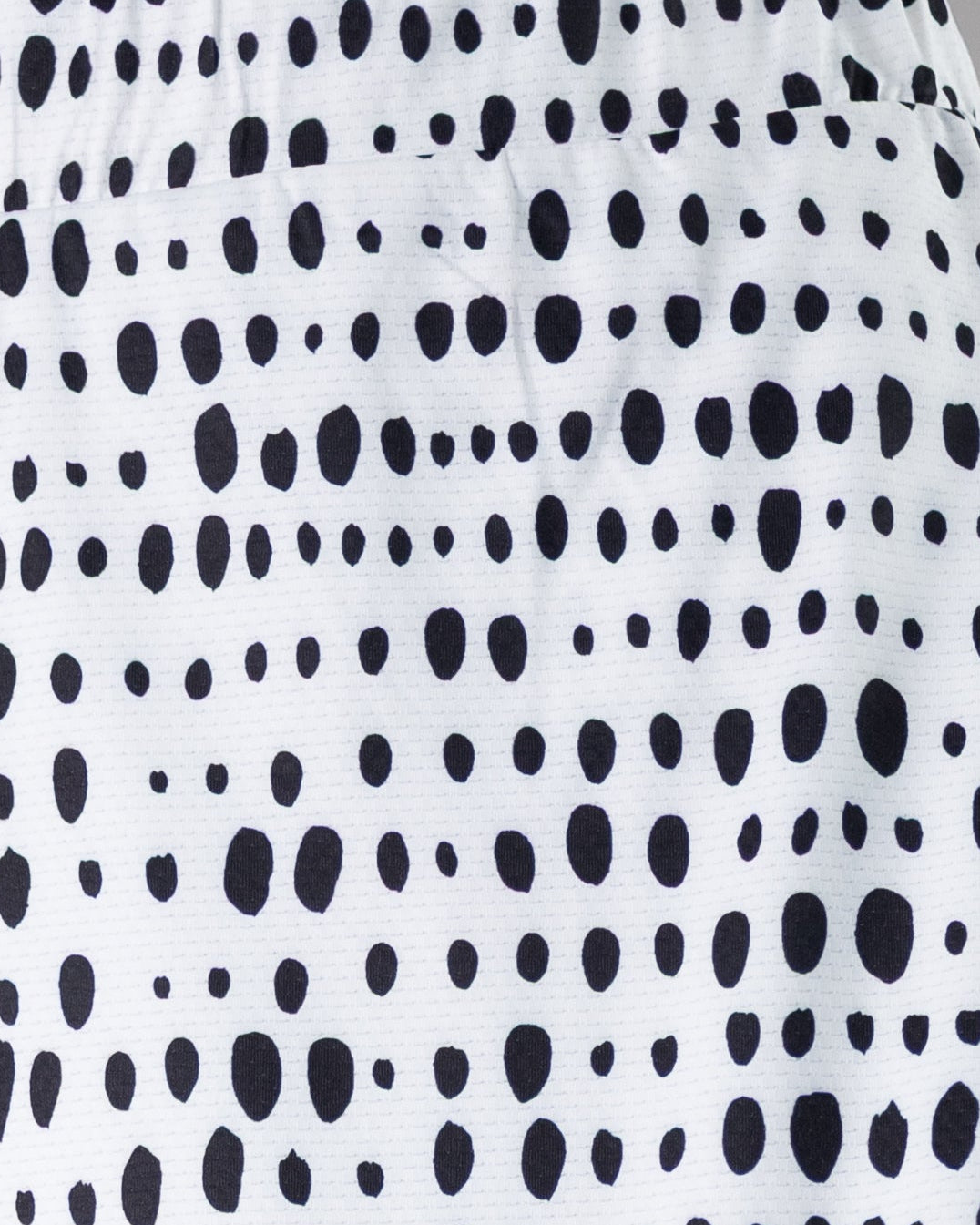 Model wearing Nuggles® 31" All-Sport Skirt in Dash Print