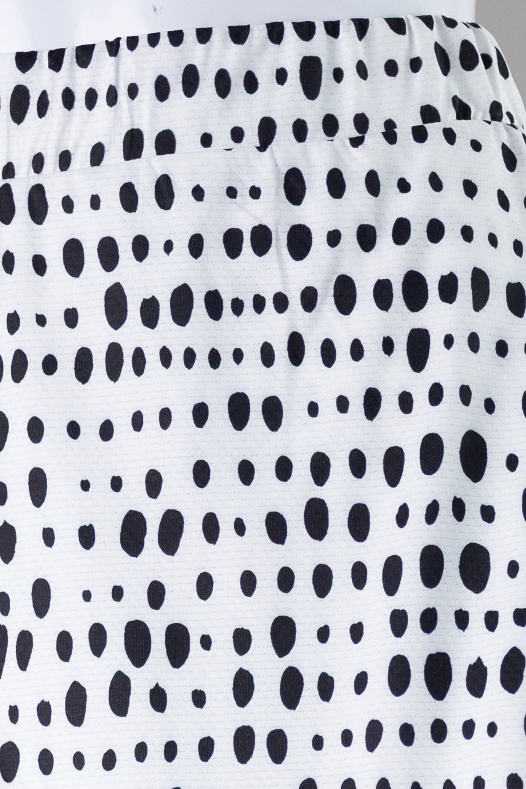 Model wearing Nuggles® 31" All-Sport Skirt in Dash Print