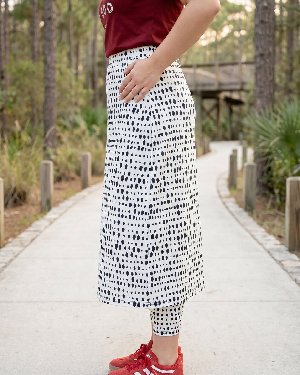 Model wearing Nuggles® 31" All-Sport Skirt in Dash Print