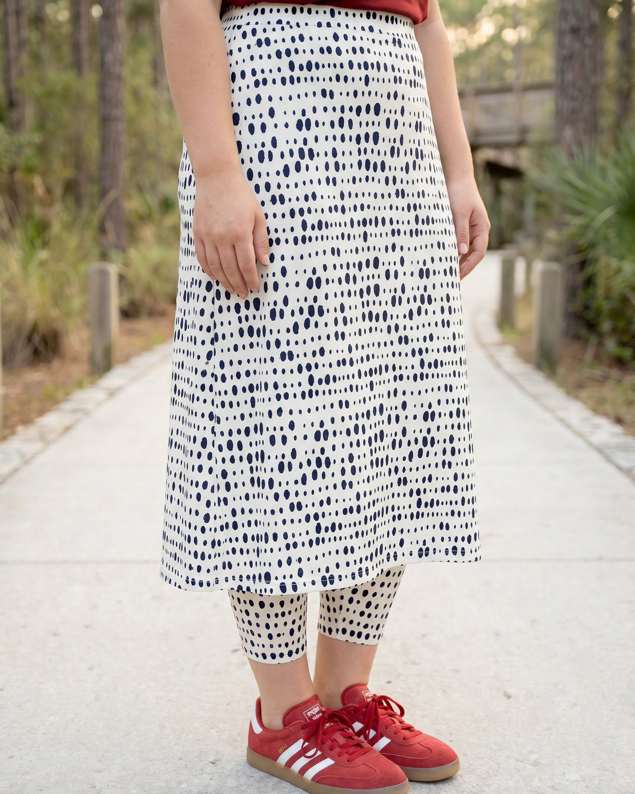Model wearing Nuggles® 31" All-Sport Skirt in Dash Print