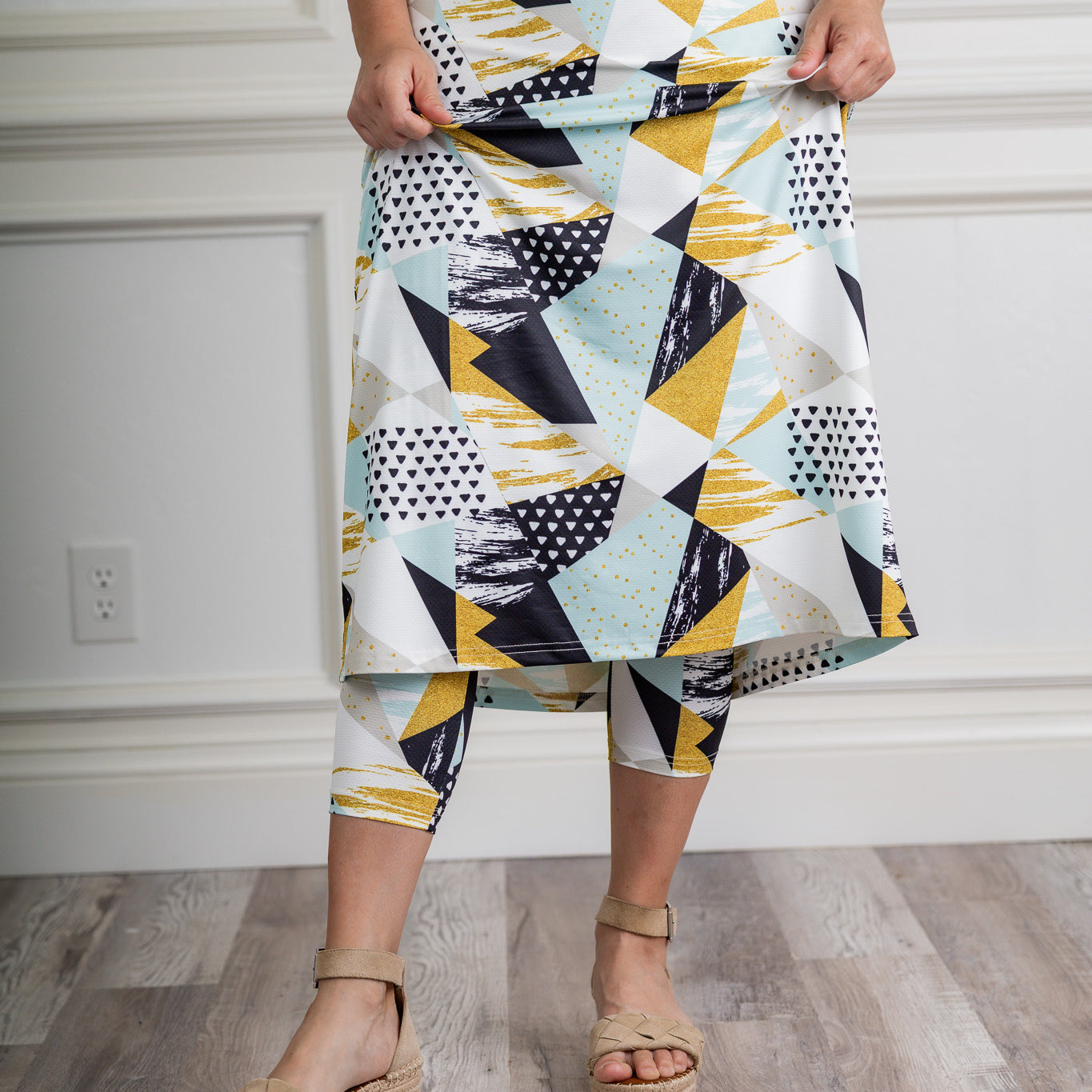 Modest activewear skirt with built-in leggings for women, breathable athletic fabric, paired with sneakers – perfect for workouts or casual wear.
