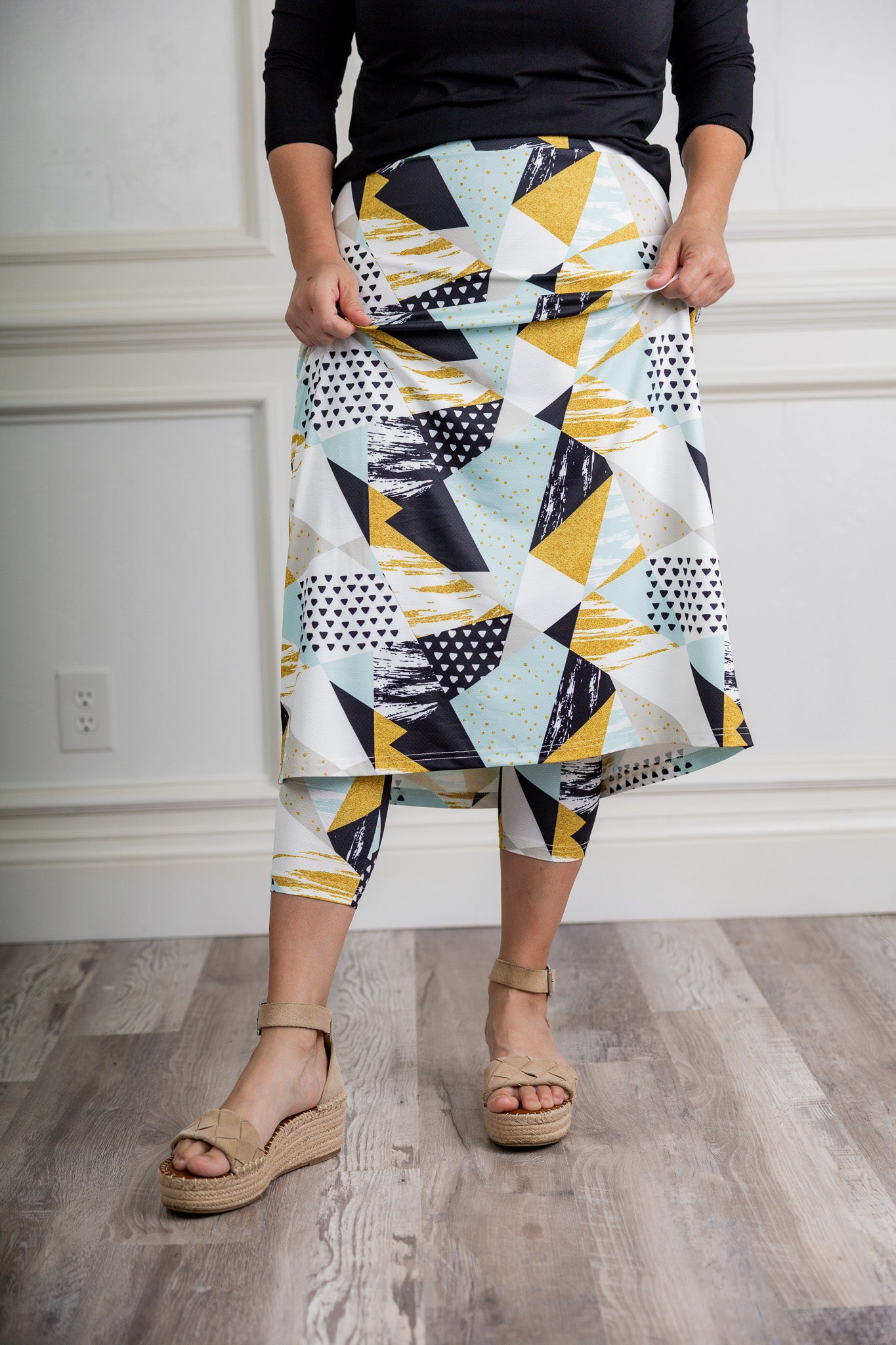 Modest activewear skirt with built-in leggings for women, breathable athletic fabric, paired with sneakers – perfect for workouts or casual wear.