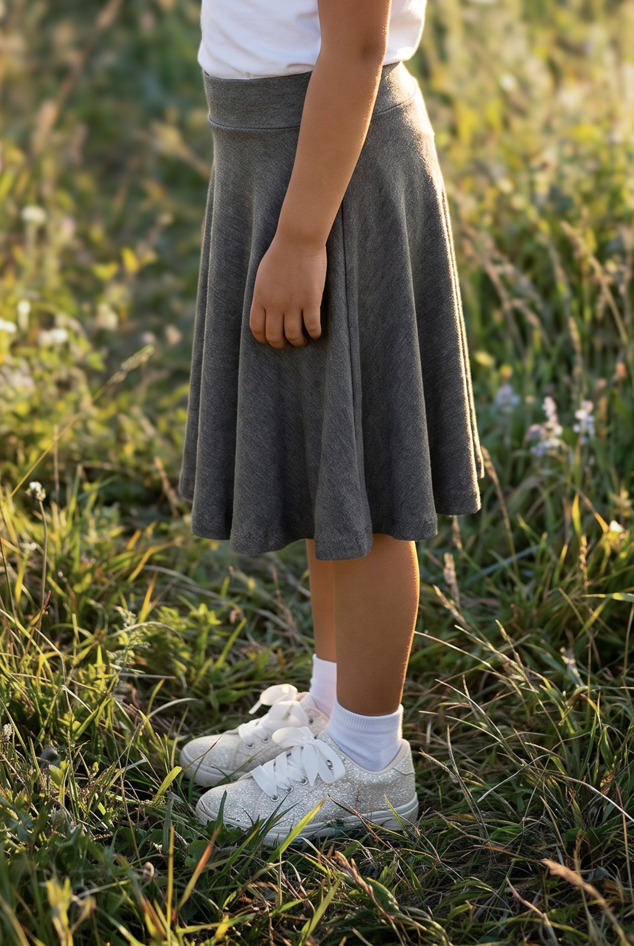 Model wearing Nuggles® Girls' Athleisure Skirt