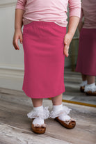 Modest girls' classic midi skirt with soft elastic waistband, knee-length fit, and durable fabric – perfect for everyday wear.