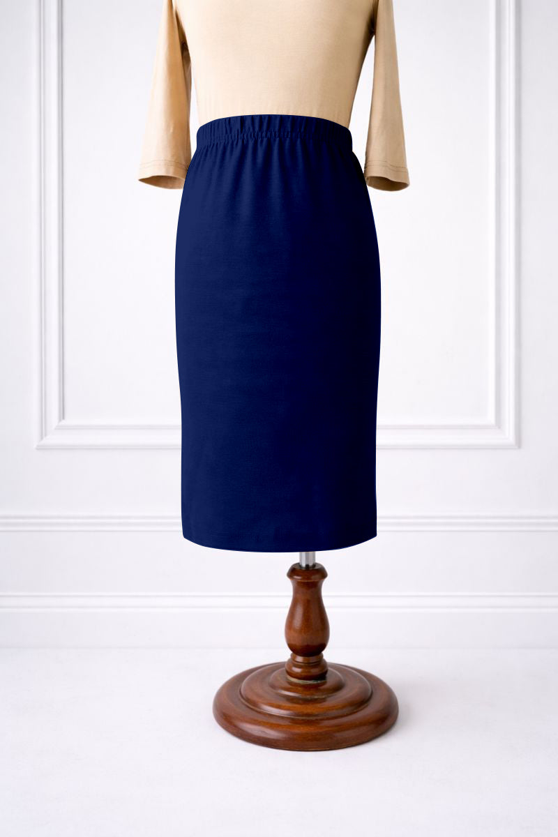 Stock photo of our Nuggles® Girls classic midi skirt elastic waistband and straight silhouette in Dark Royal