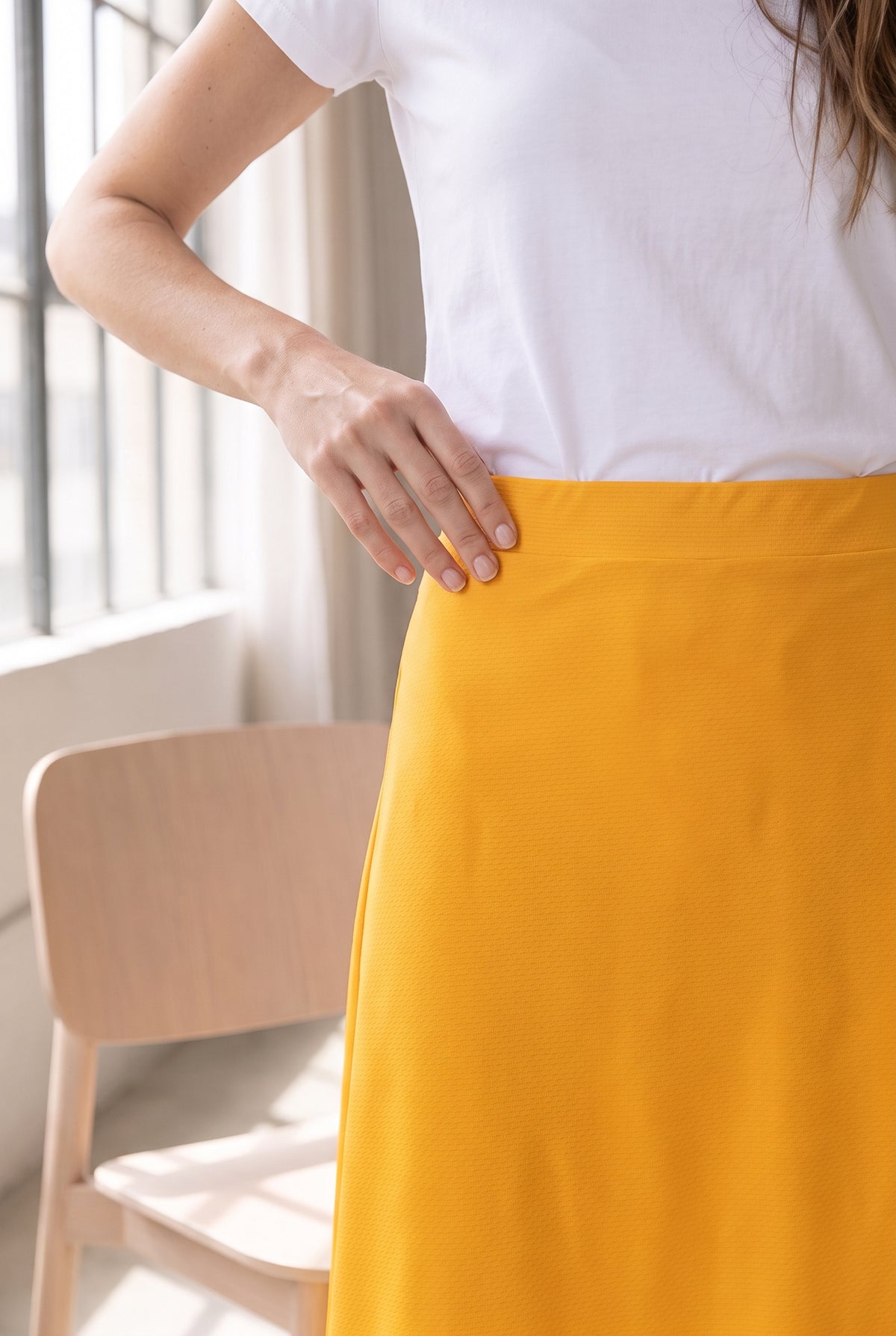 Model wearing Nuggles® 31" Sport Skirt in Gold