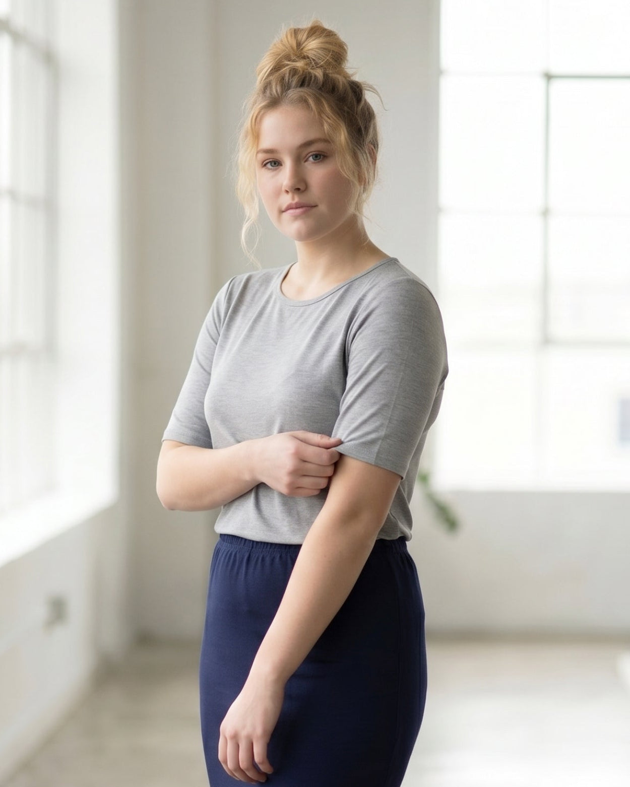 Model wearing Nuggles® Half Sleeve Essential Tee in Light Heather