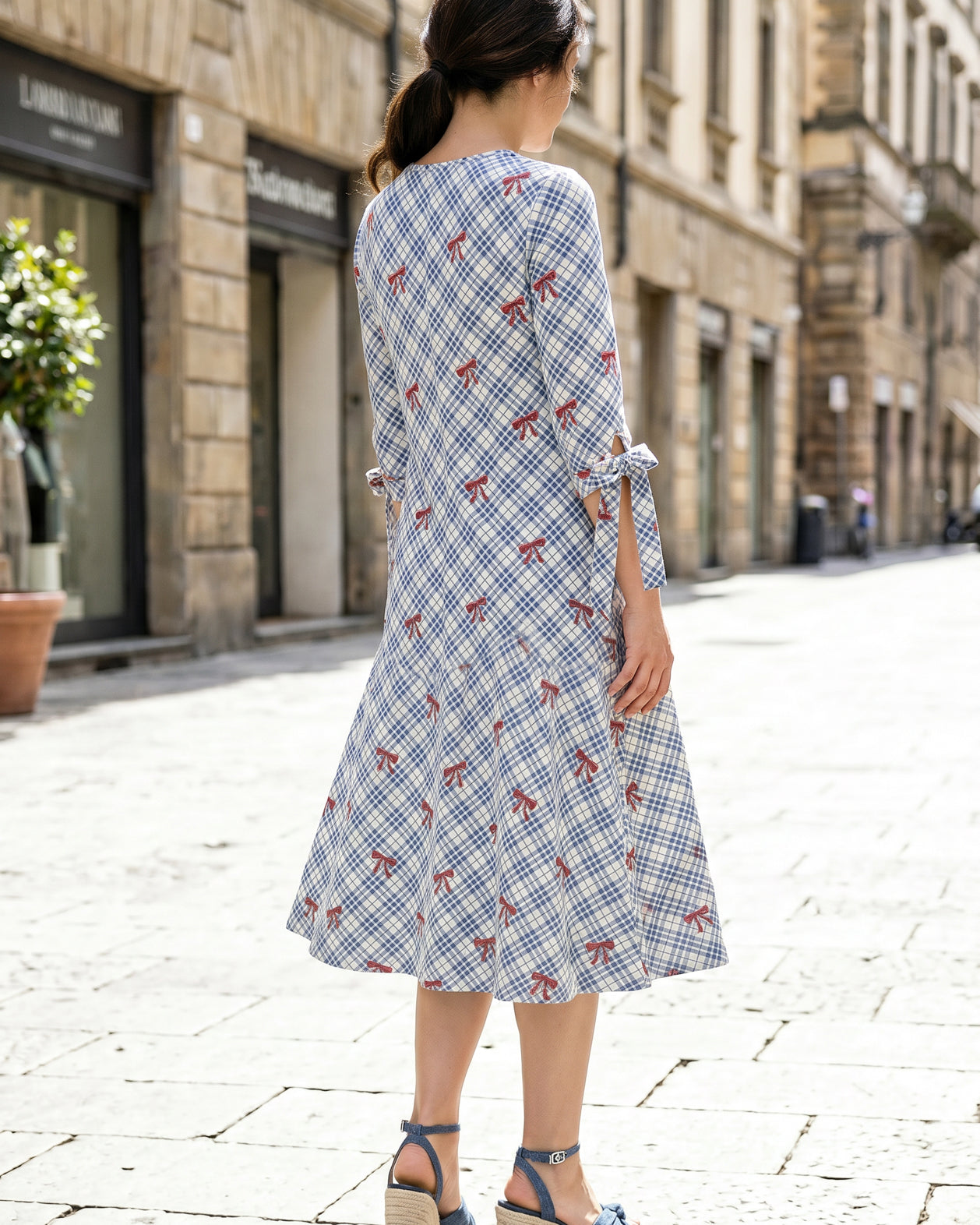 Model wearing Nuggles® Hazel Dress in Sunday Bow