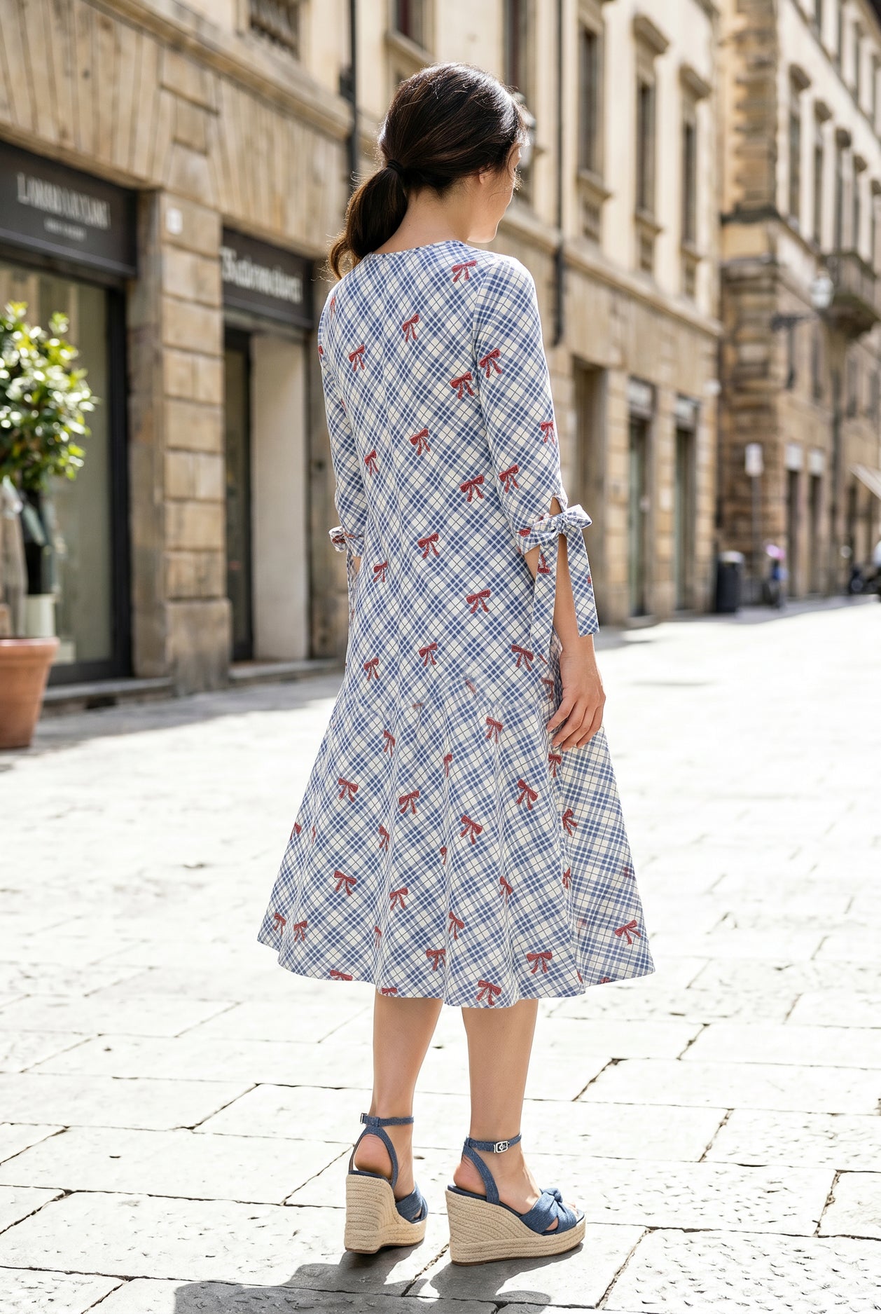 Model wearing Nuggles® Hazel Dress in Sunday Bow