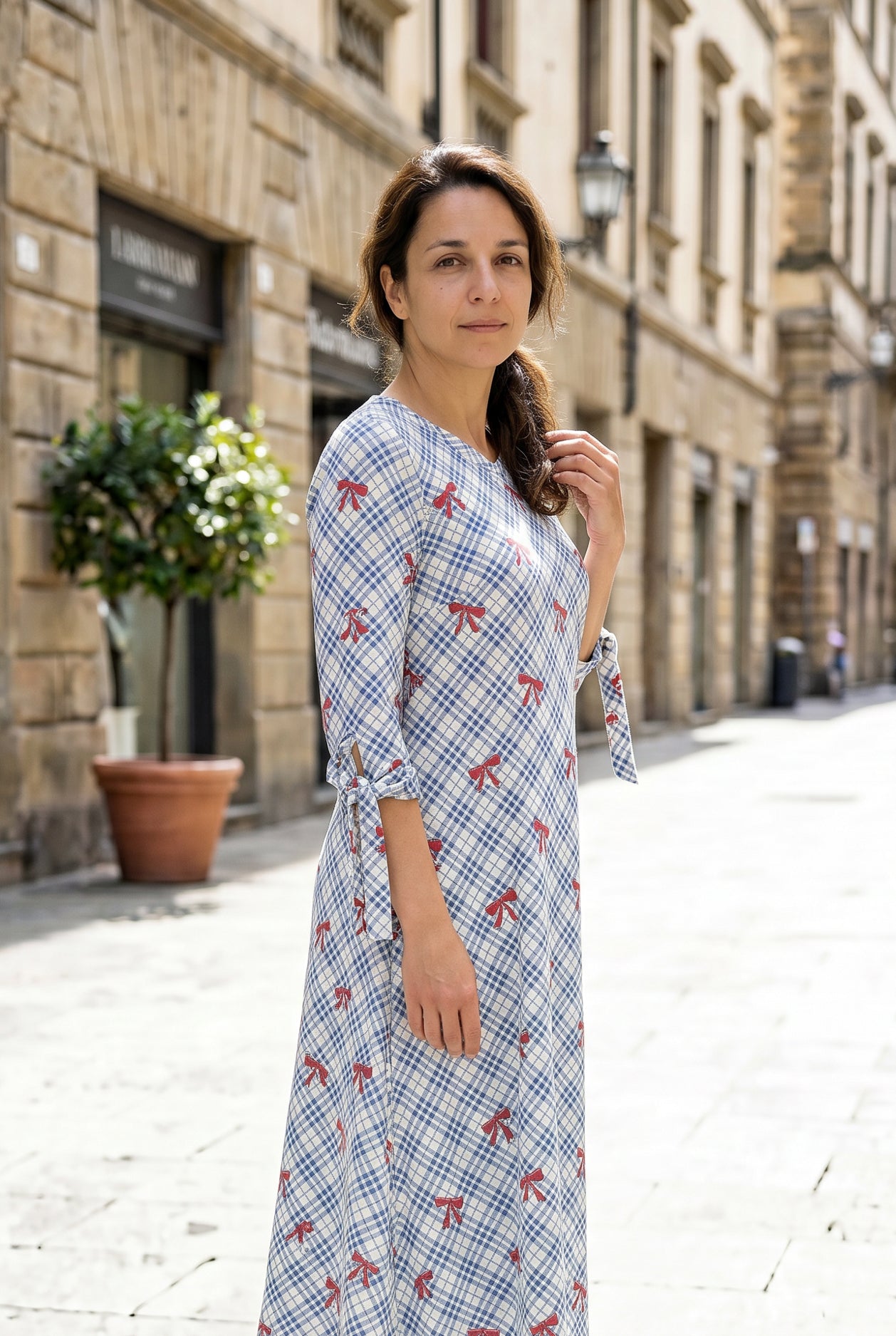 Model wearing Nuggles® Hazel Dress in Sunday Bow