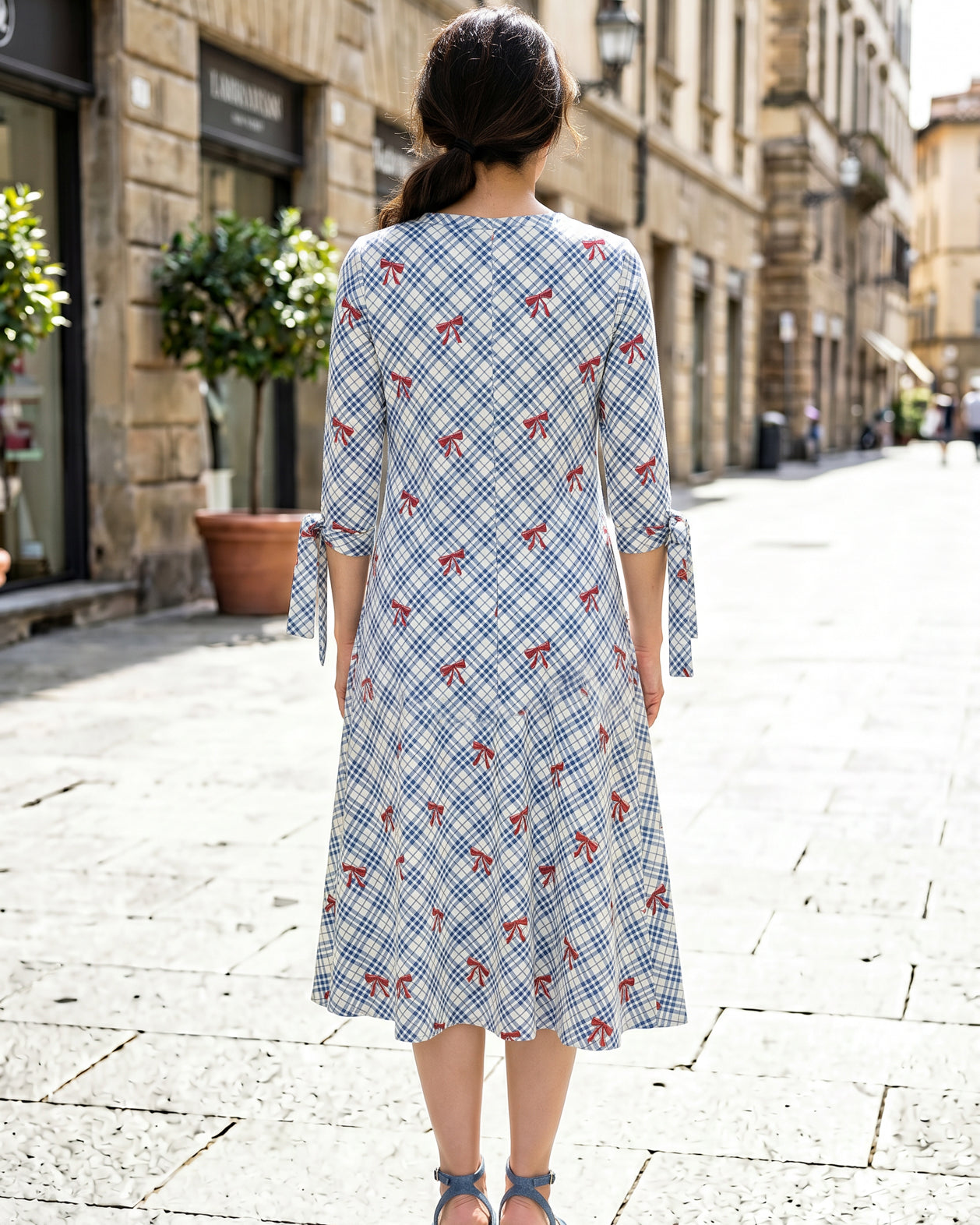 Model wearing Nuggles® Hazel Dress in Sunday Bow