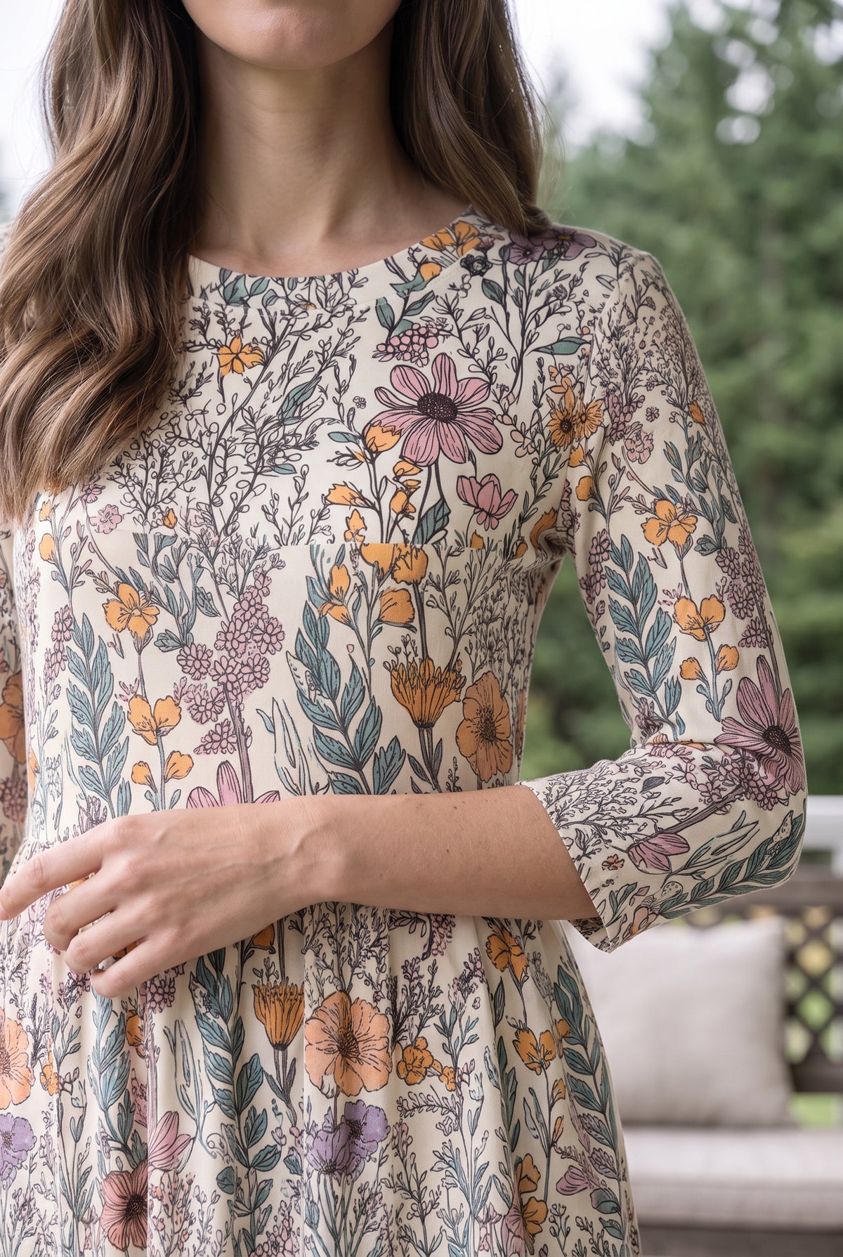 Nuggles® Cleo Maxi Dress in Hedgerow, close-up of the bodice and 3/4 sleeve with one hand at the gathered waist