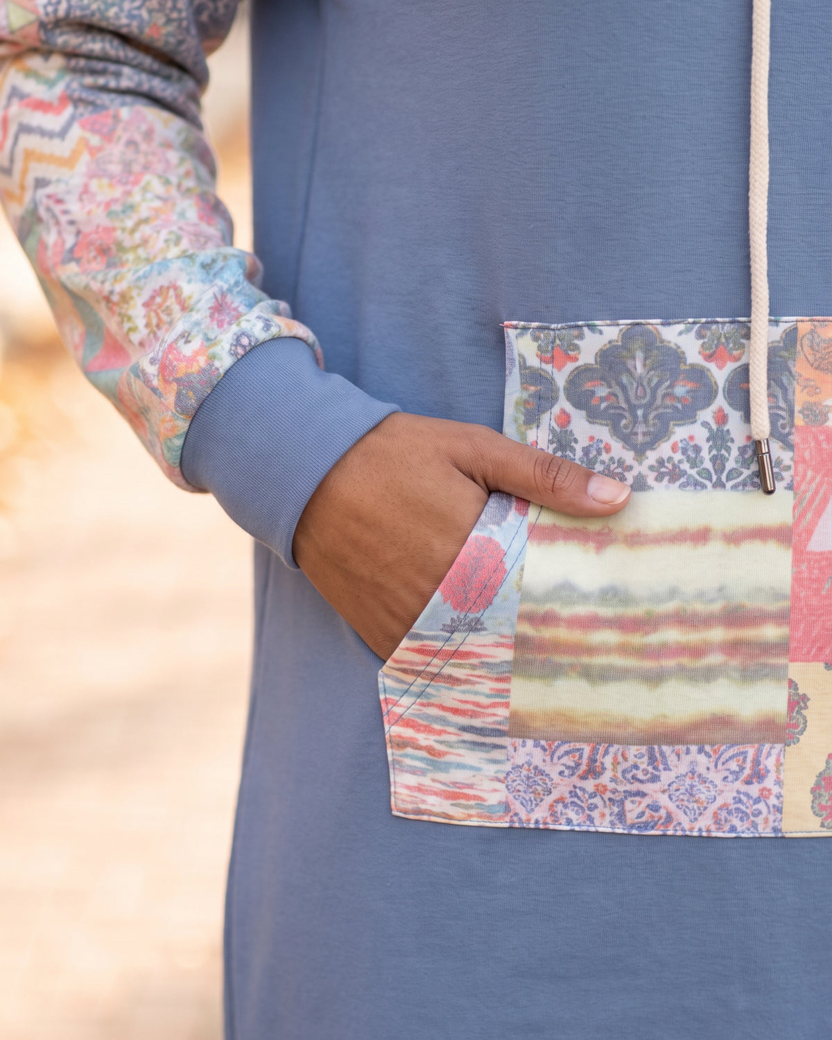 Model wearing Nuggles® Hoodie Dress in Boho Mosaic
