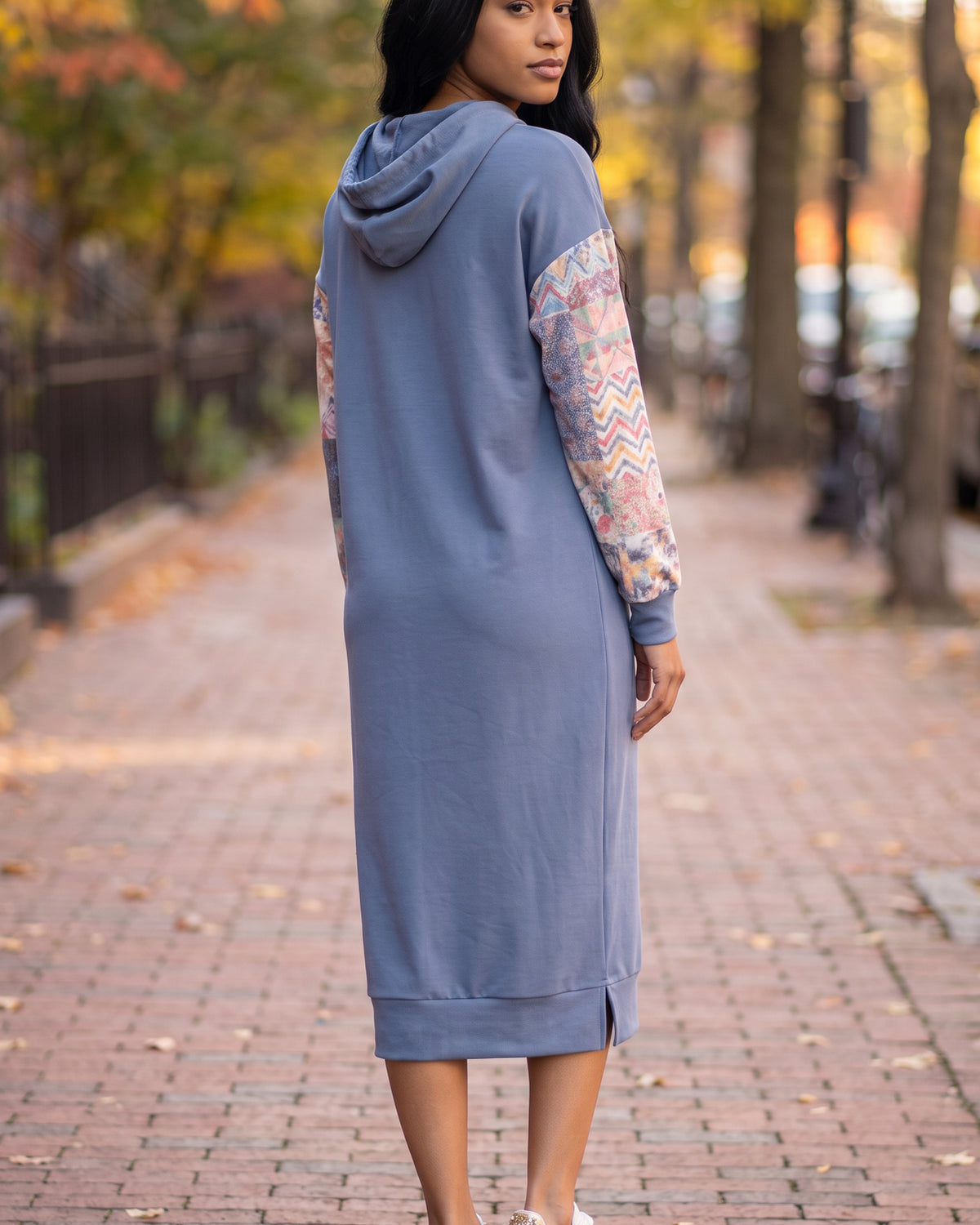 Model wearing Nuggles® Hoodie Dress in Boho Mosaic