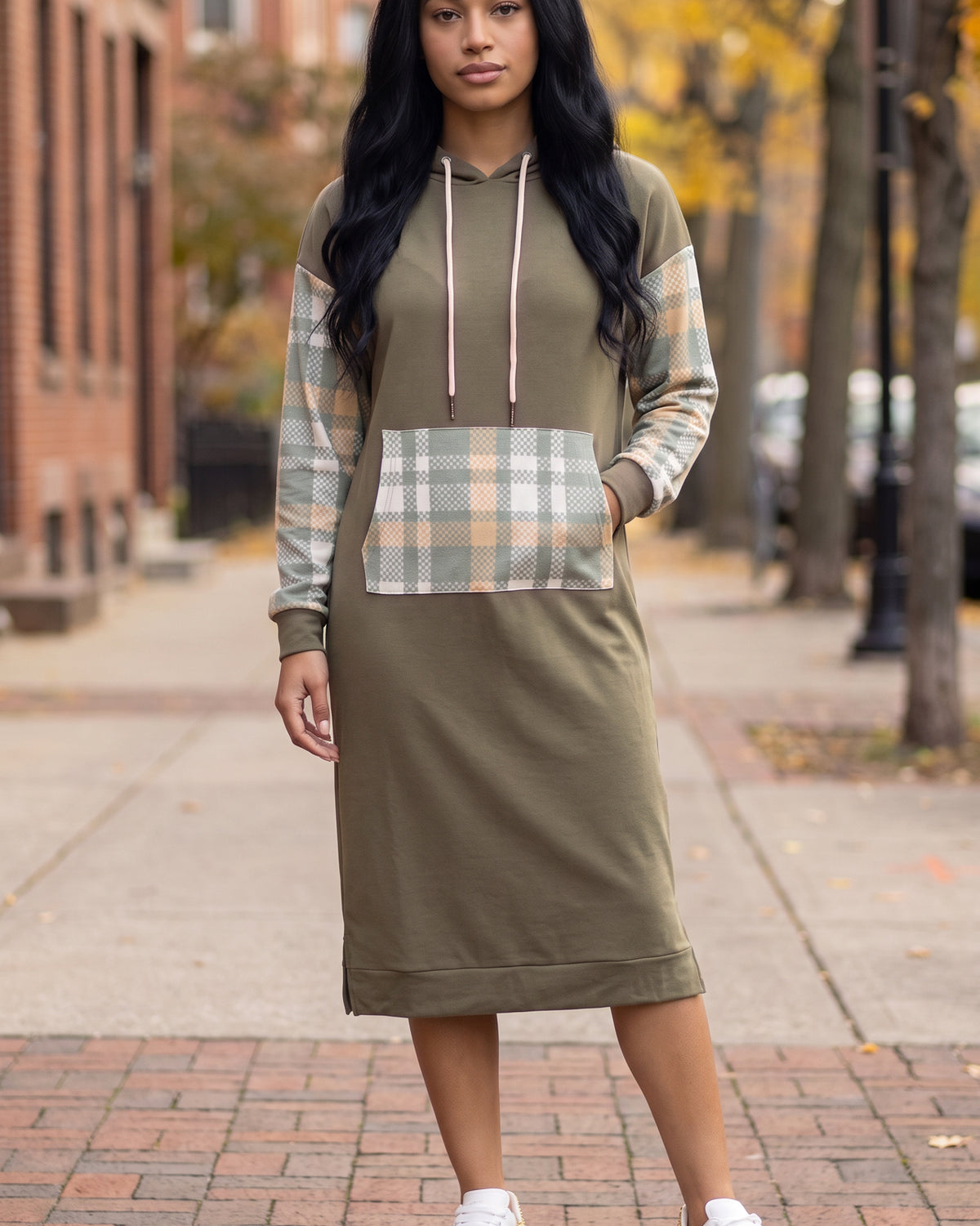 Model wearing Nuggles® Hoodie Dress in Olive Plaid