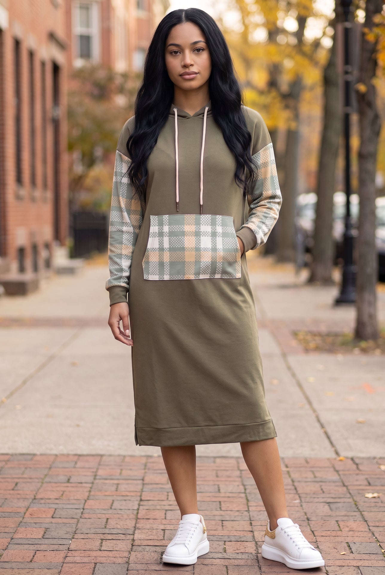 Model wearing Nuggles® Hoodie Dress in Olive Plaid