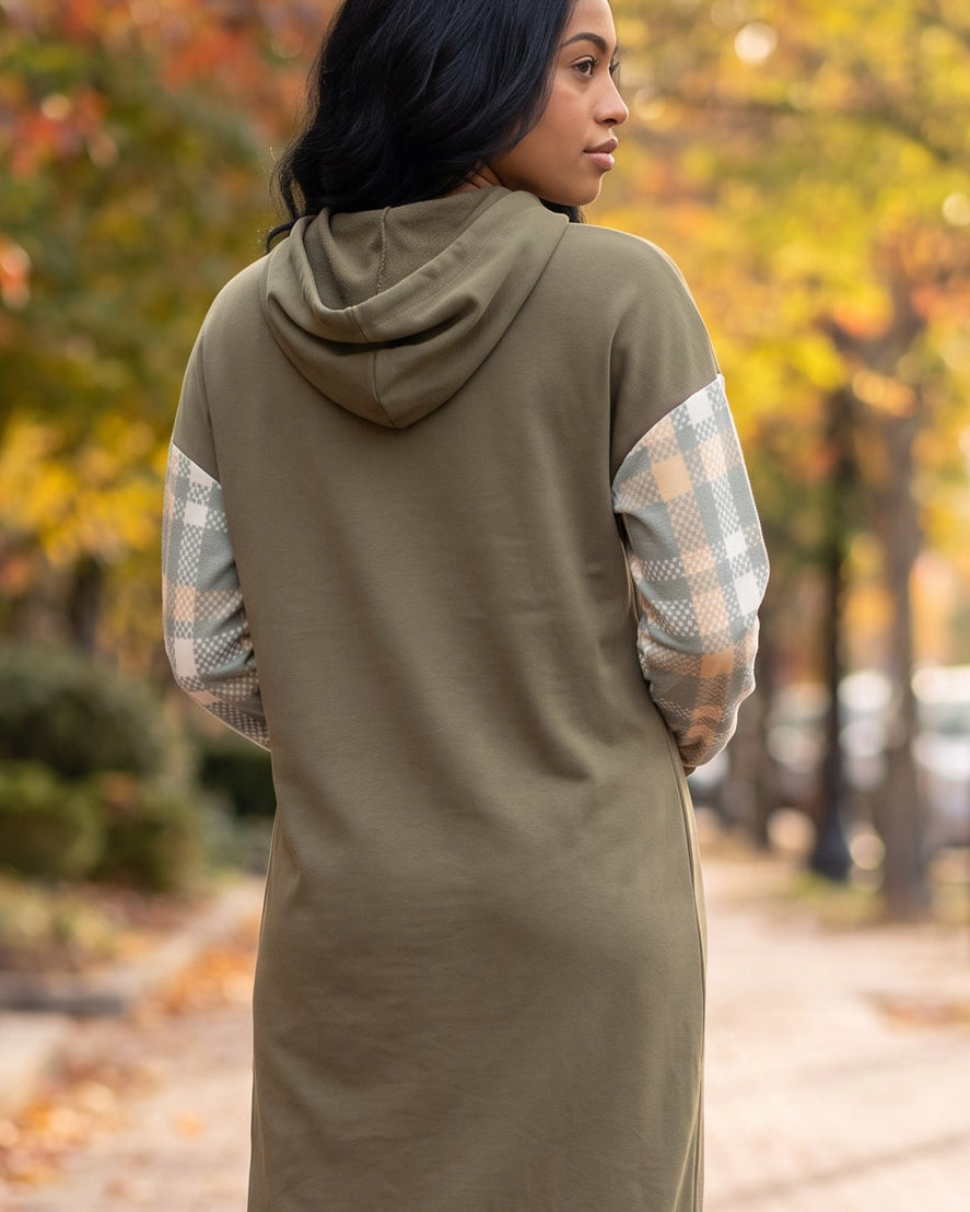 Model wearing Nuggles® Hoodie Dress in Olive Plaid