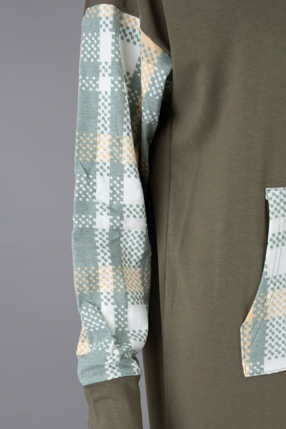 Model wearing Nuggles® Hoodie Dress in Olive Plaid