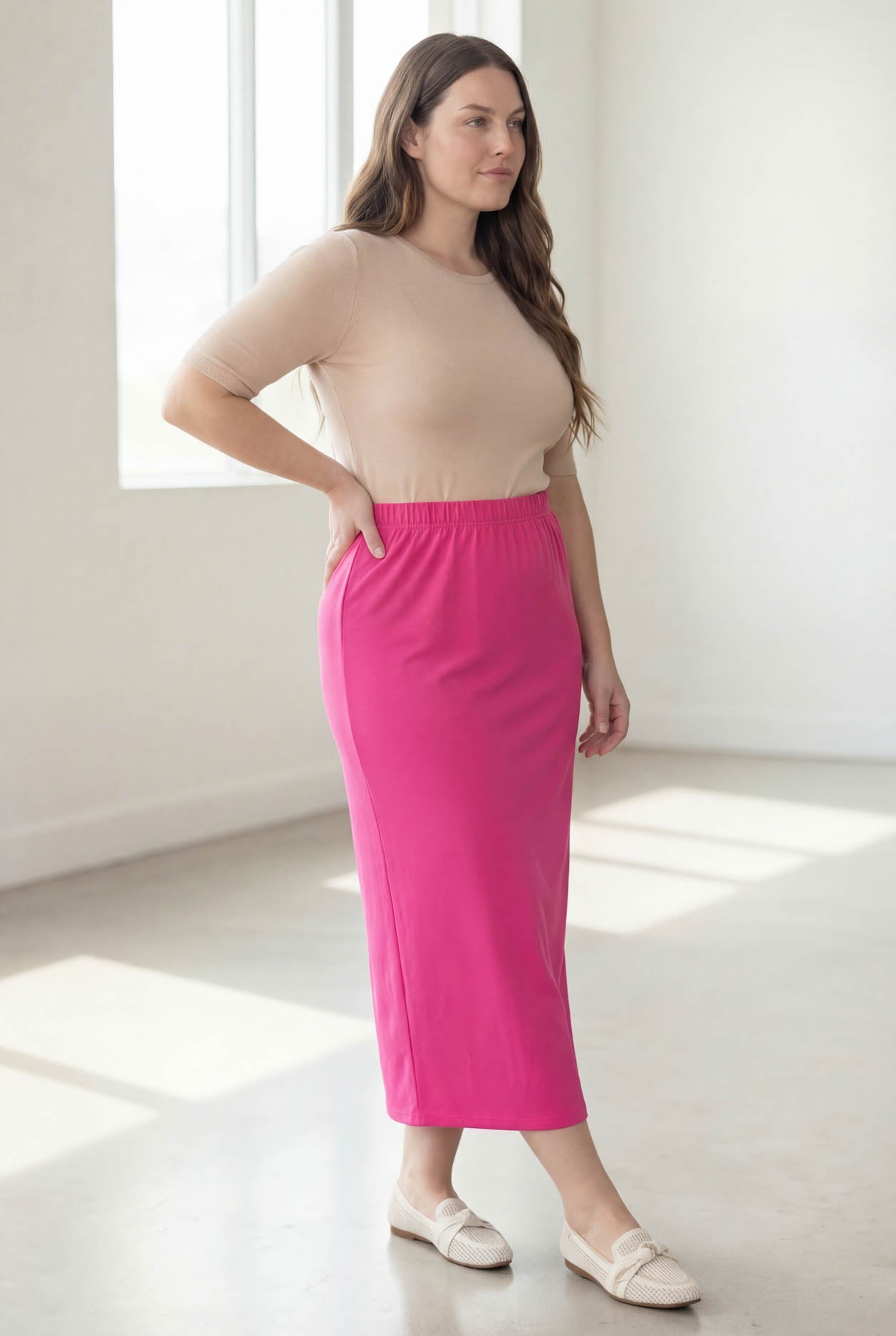 Model wearing Nuggles® 34" Classic Skirt in Hot Pink