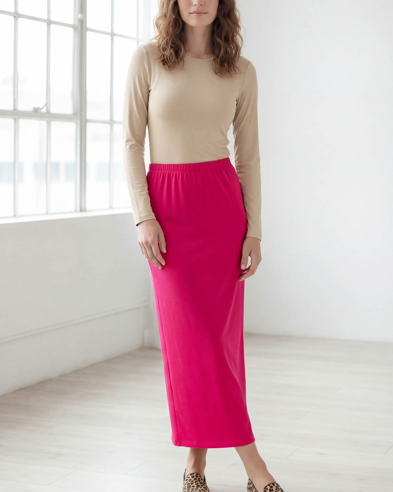 Model wearing Nuggles® 36" Classic Skirt in Hot Pink