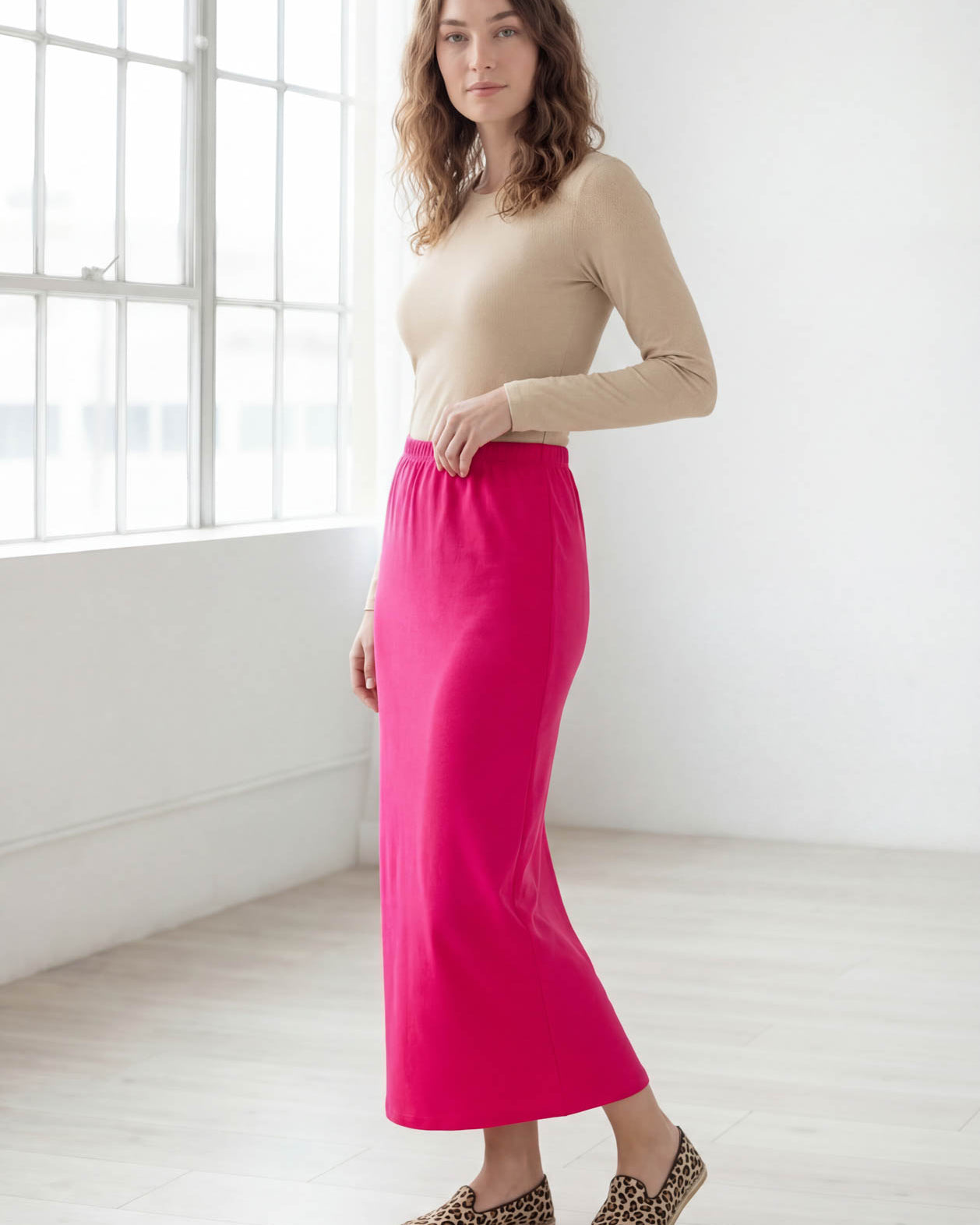 Model wearing Nuggles® 36" Classic Skirt in Hot Pink