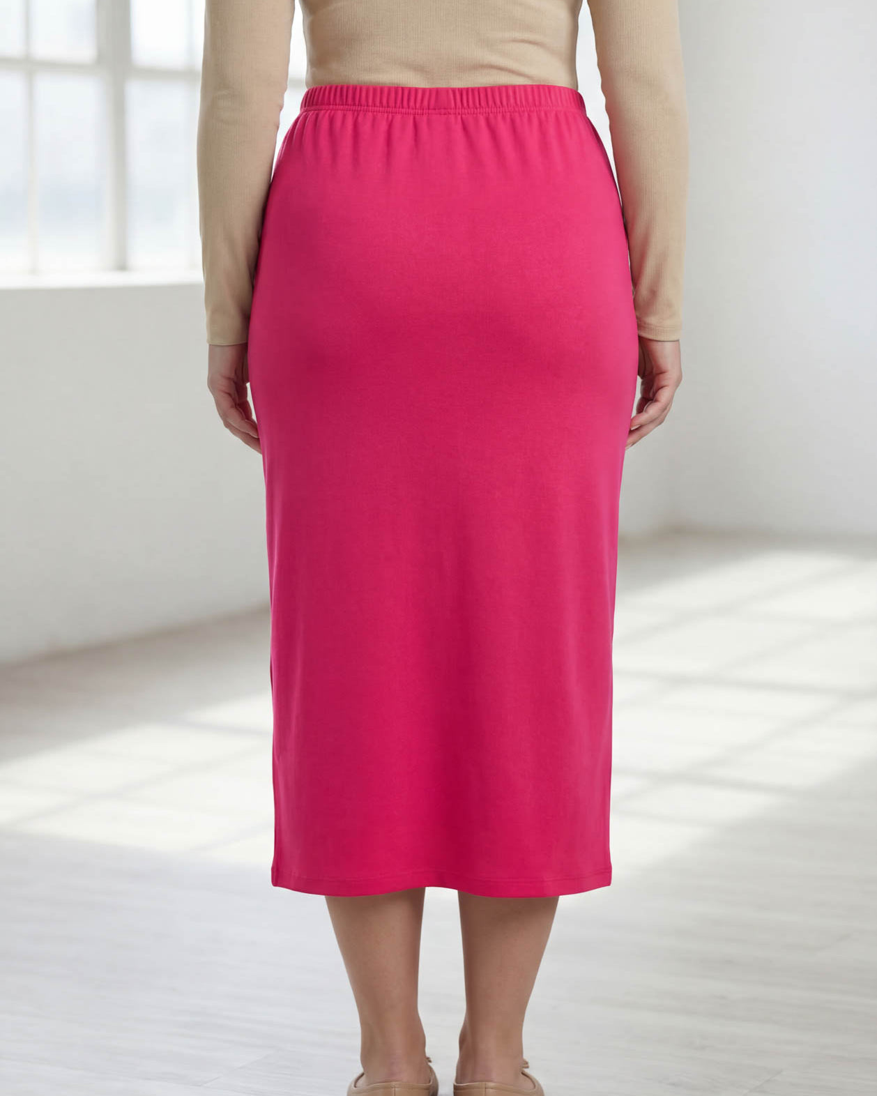 Model wearing Nuggles® 31" Classic Skirt in Hot Pink
