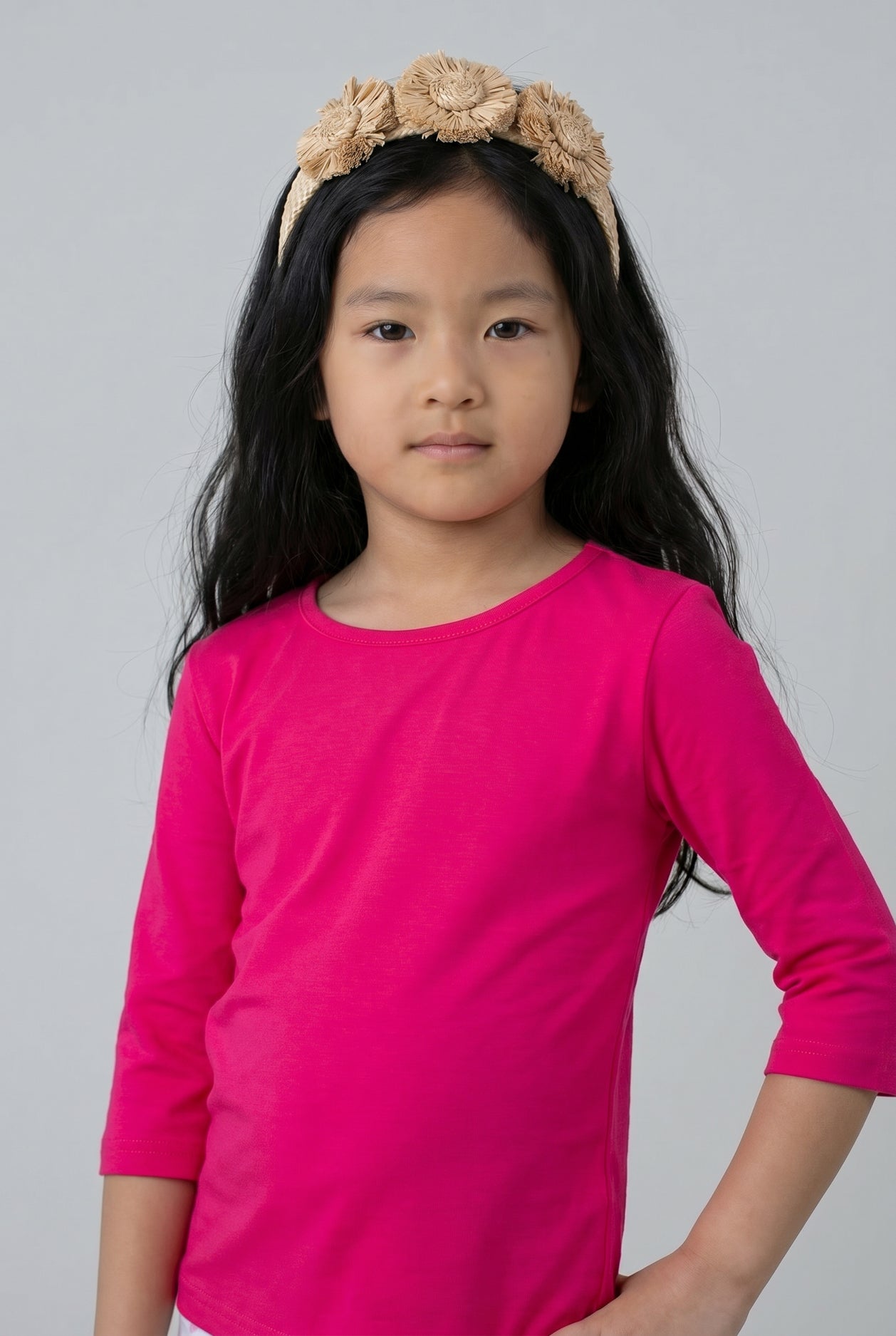 Model wearing the Girls' Nuggles® 3/4 Essential Tee in Hot Pink