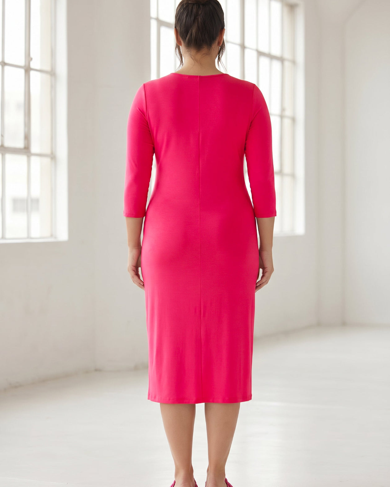 Model wearing Nuggles® Midi Layering Dress in Hot Pink