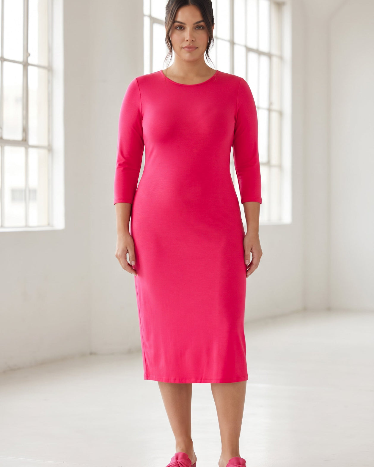 Model wearing Nuggles® Midi Layering Dress in Hot Pink