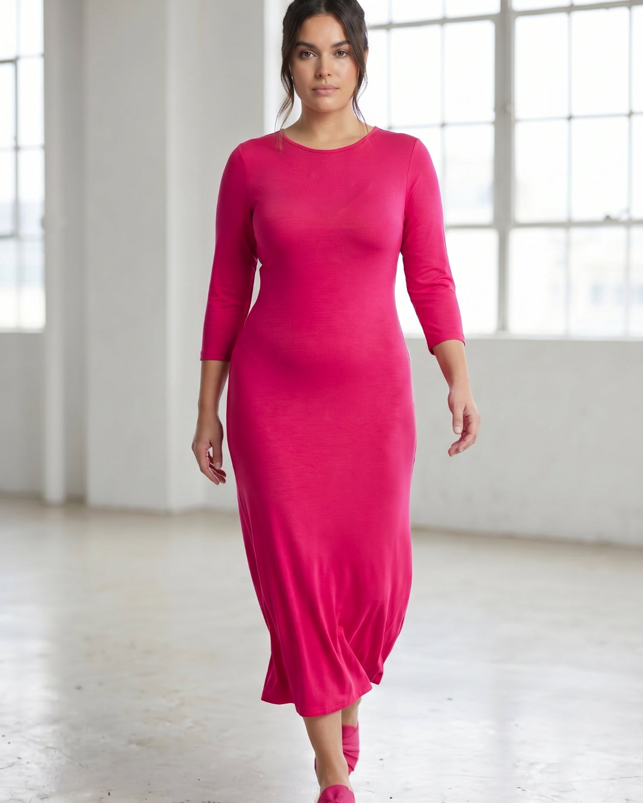 Model wearing Nuggles® Tea Layering Dress in Hot Pink