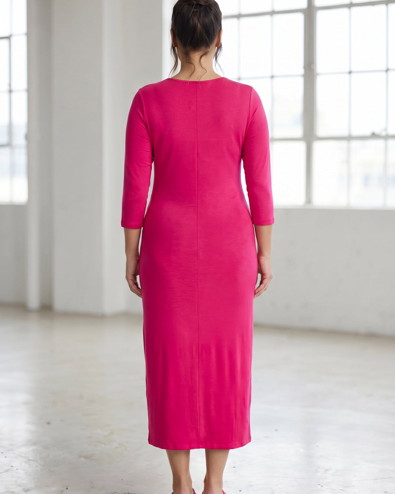 Model wearing Nuggles® Tea Layering Dress in Hot Pink