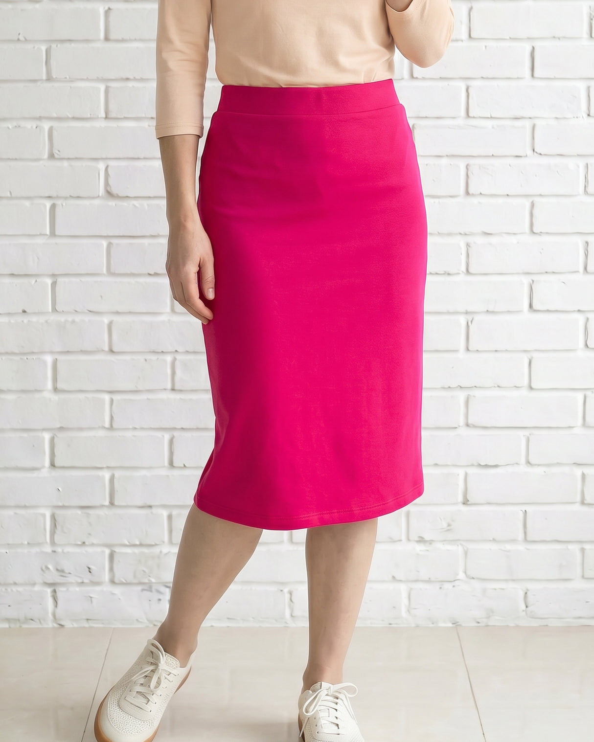 Model wearing Nuggles® 27" Relaxed Skirt in Hot Pink