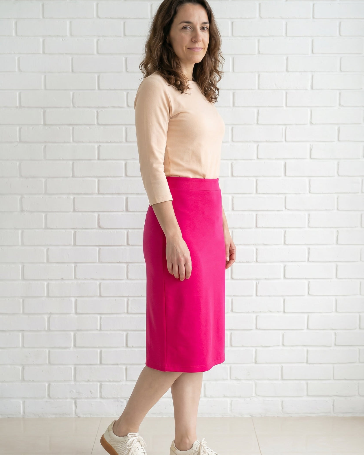 Model wearing Nuggles® 27" Relaxed Skirt in Hot Pink