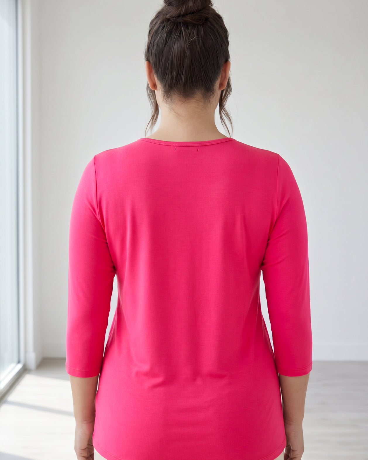 Model wearing Nuggles® 3/4 Essential Tee in Hot Pink