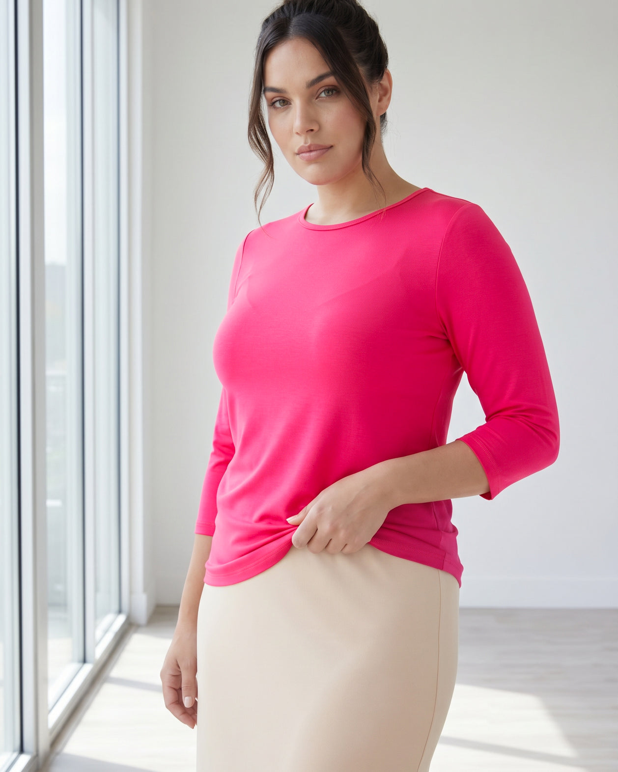 Model wearing Nuggles® 3/4 Essential Tee in Hot Pink