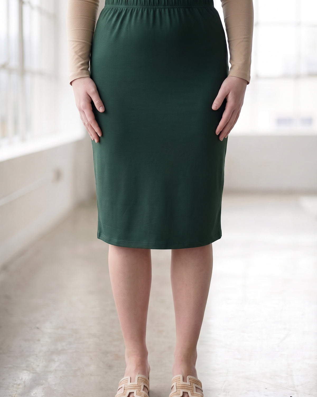 Model wearing Nuggles® 27" Classic Skirt in Hunter Green