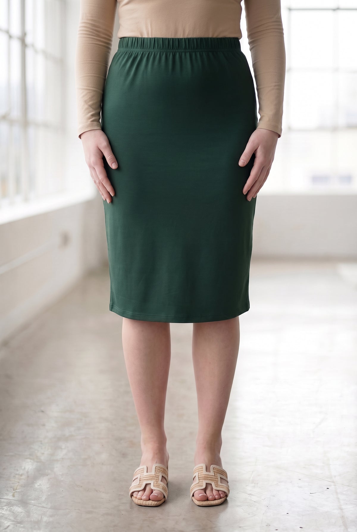 Model wearing Nuggles® 27" Classic Skirt in Hunter Green